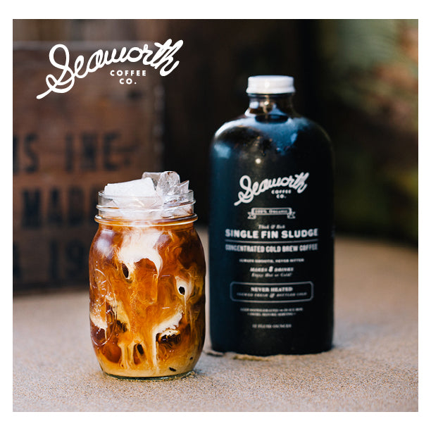 Seaworth Organic Cold Brew concentrate in a 32 oz Single Fin Sludge bottle